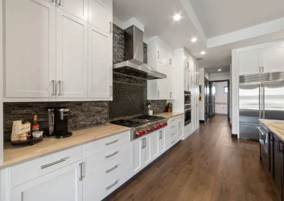 a kitchen with white cabinets