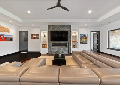 Living Area with TV, fireplace, and ceiling fan