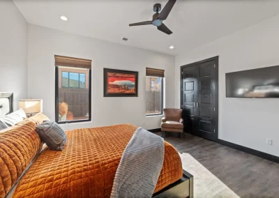 bedroom with a queen bed and ceiling fan