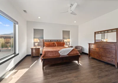 bedroom with a king bed with dresser and mirror